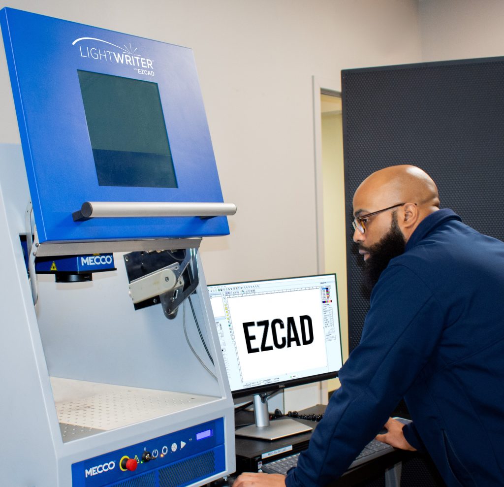 Mecco Employee using the Lightwrite with EZCAD Machine